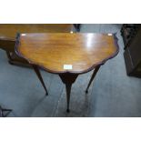 A mahogany demi lune hall table