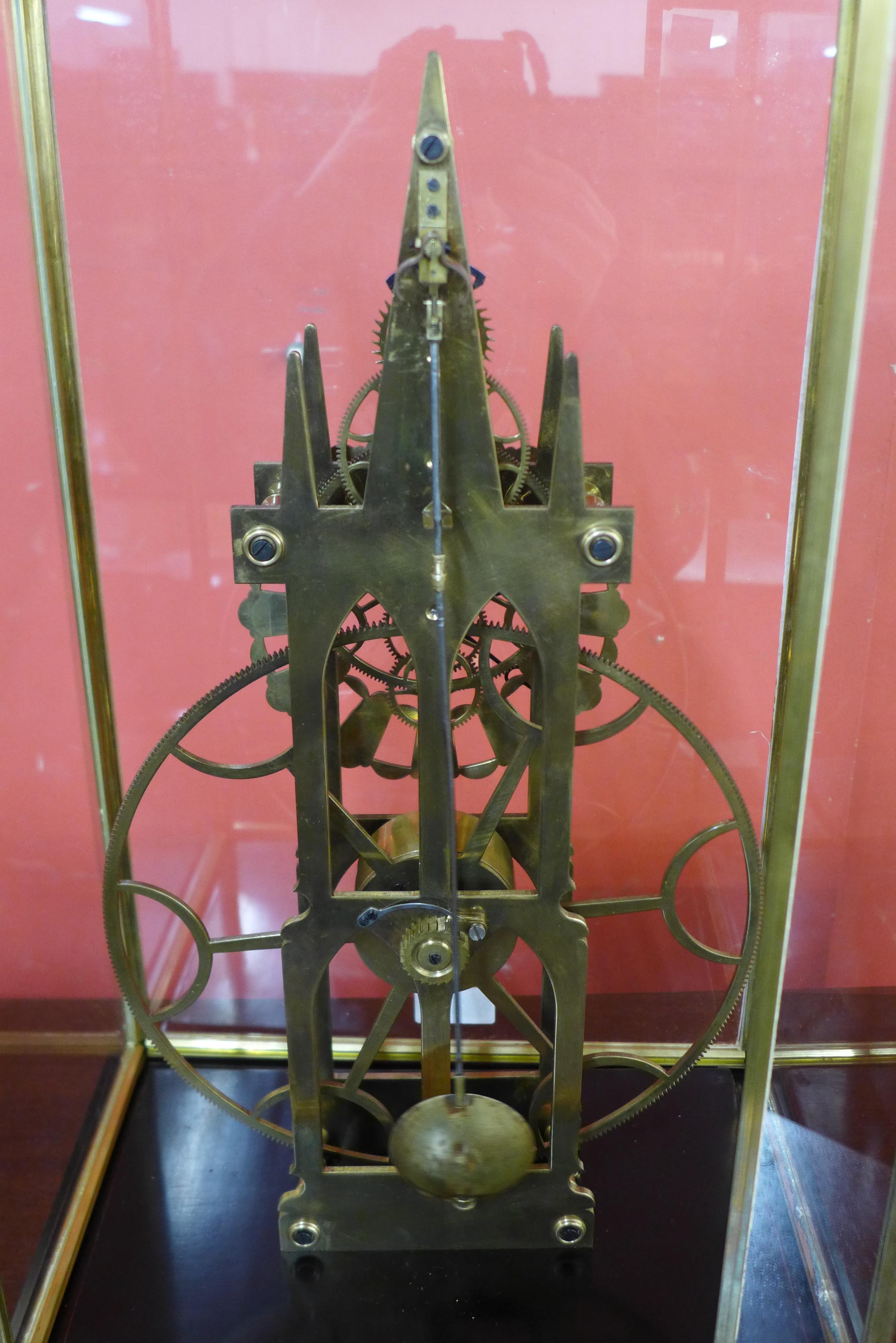 A cased brass skeleton clock, 54cms h - Image 2 of 2