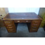 An early 20th Century oak pedestal desk