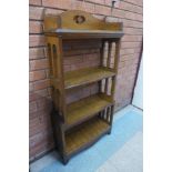 An Arts and Crafts oak open bookcase, 126cms h x 62cms w