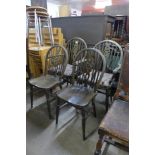 A set of four beech wheelback chairs