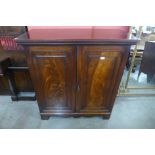 A George III mahogany two door press cupboard, 117cms h, 110cms w, 51cms d