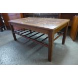 A teak and tiled topped coffee table