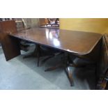 A Regency style mahogany extending pedestal dining table