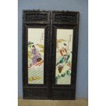 A pair of Chinese painted plaques in carved hardwood frames