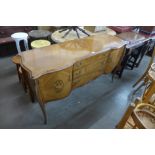 A French style inlaid mahogany serpentine sideboard