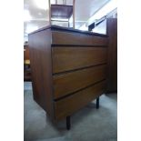 A teak chest of drawers