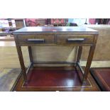 An Art Deco oak two drawer writing table