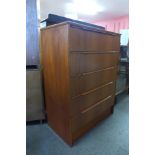 A teak chest of drawers