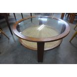 A G-Plan teak, rattan and glass topped circular coffee table