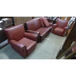 An Art Deco red leather three piece suite