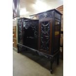 An Edward VII Chippendale Revival ebonised side cabinet
