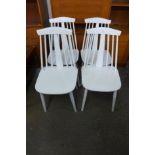 A set of four painted kitchen chairs