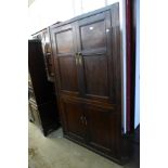 A George III oak freestanding corner cupboard