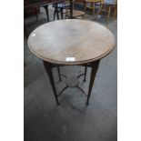 An Arts and Crafts walnut circular occasional table, 69cms h