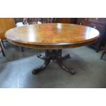 A Victorian burr walnut oval tilt-top breakfast table, 69cms h, 136cms l, 102cms w