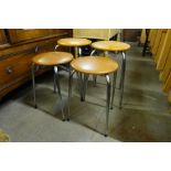 A set of four chrome and vinyl stools