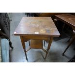 An Arts and Crafts oak occasional table and two others