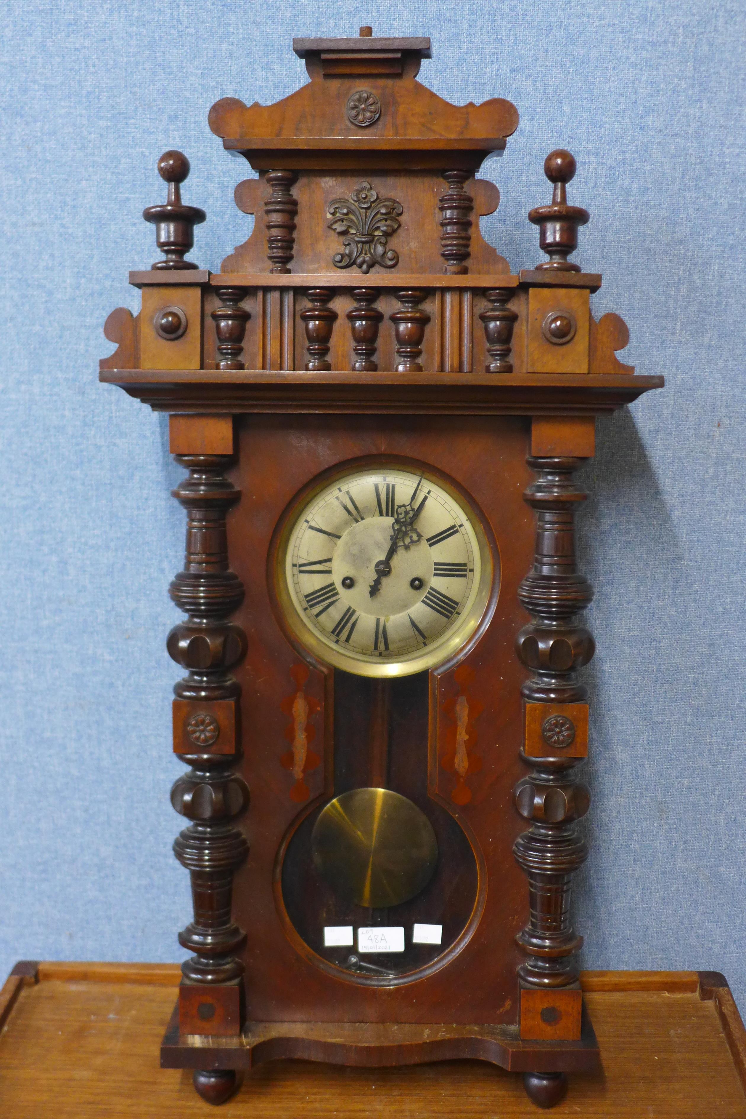 A 19th Century walnut Vienna wall clock, 86cms h