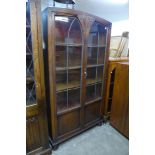 An oak dome topped two door bookcase