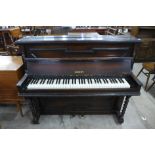 A Regent oak barleytwist overstrung upright piano