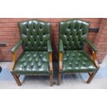 A pair of Regency style mahogany and green leather library chairs, 100cms h, 62cms w, 61cms d