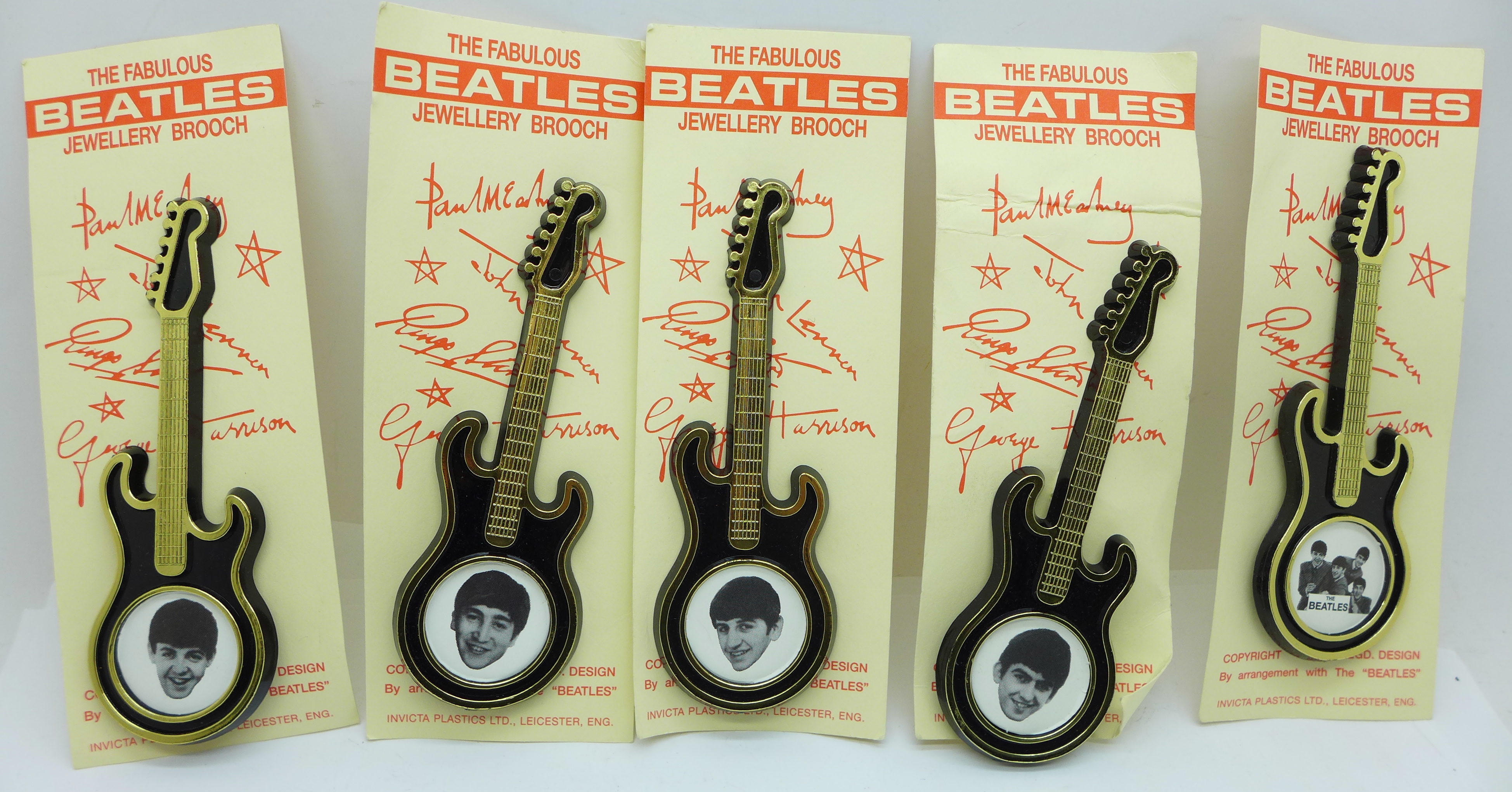 A set of five The Beatles guitar brooches