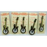A set of five The Beatles guitar brooches