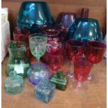 A collection of coloured glass including cranberry glass wines, vase, jug, large brandy glasses, ink
