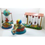 Three tin-plate fairground rides, two carousels and flying boats