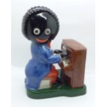 A limited edition Carlton Ware hand-painted figure, 309/1250, The Piano Player