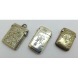A Victorian silver vesta case with monogram, one other silver vesta case and a smaller unmarked