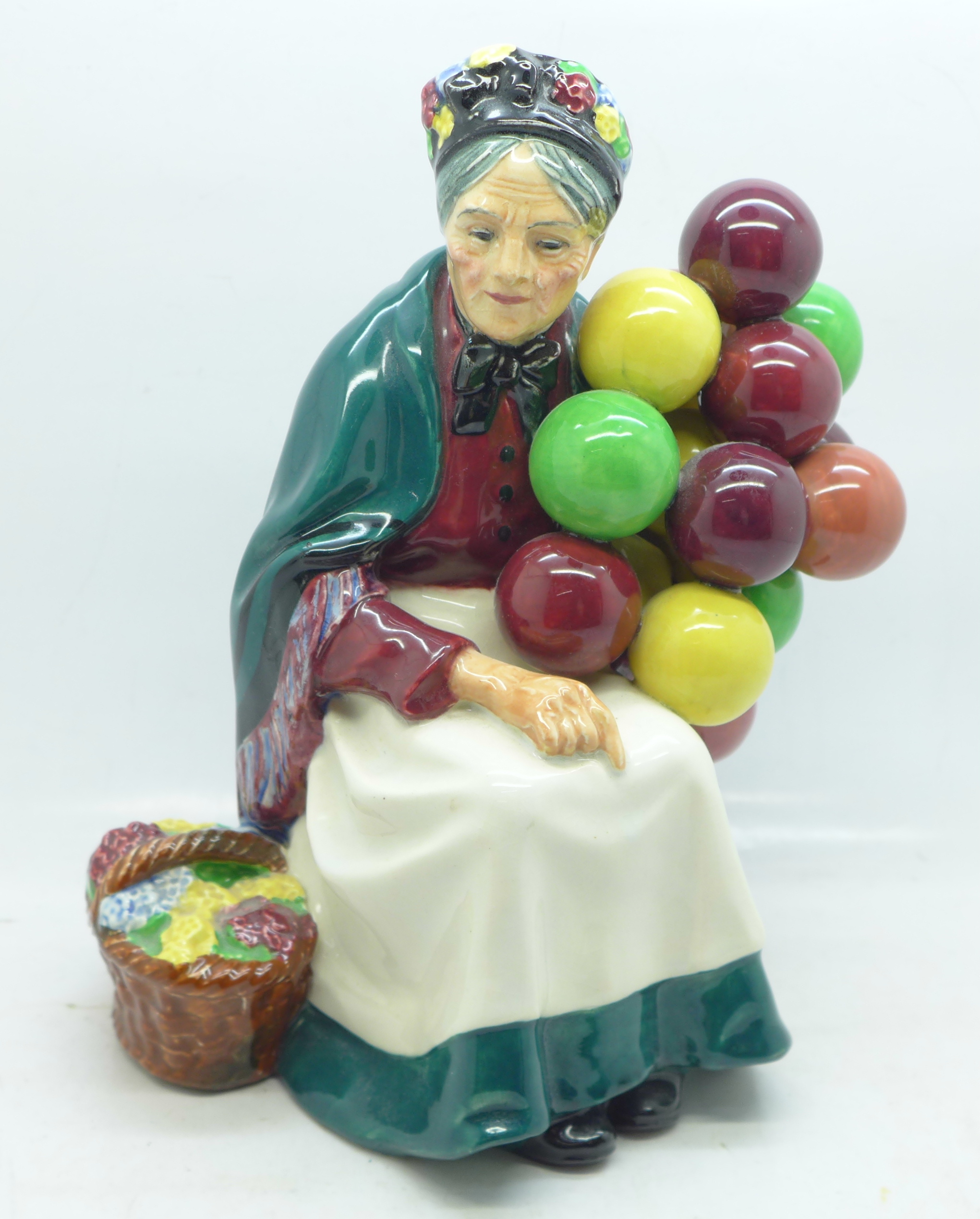 A Royal Doulton figure, The Old Balloon Seller, H1315, 20cm