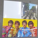Three The Beatles 2009 re-issue LP records, Abbey Road, Sgt. Peppers and the White Album