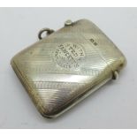 A silver vesta case, Birmingham 1920, by I.S. Greenberg & Co., with inscription, 'With Ted Fawcett's