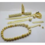 Antique ivory jewellery including two bead necklaces, carved penguin, needle case (a/f), and two