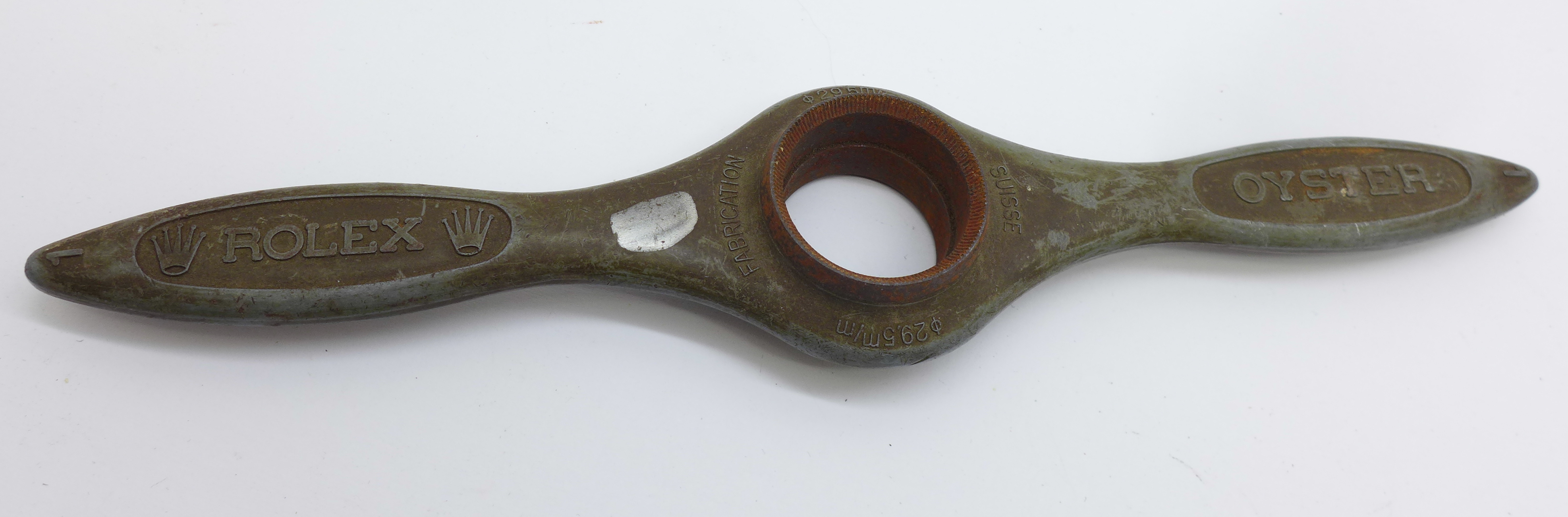 A Rolex watch opening tool, 28.3mm and 29.5mm, a/f (rust)