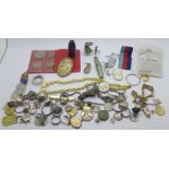 An ivory necklace, earrings, silver coins, etc.