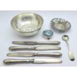 A pierced silver dish, Birmingham 1902, a white metal bowl, four silver handled knives, a pill box