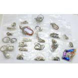 Twenty-five silver and silver mounted pendants and chains