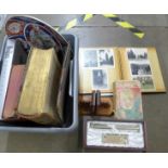 A box of assorted items including two Holy Bibles, books including The Beatles Anthology, a pair