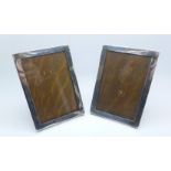 A pair of silver photograph frames with oak backs and stands, Birmingham 1945, 10cm x 14cm