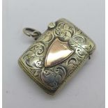 A small late Victorian silver vesta case with a marked 9ct gold shield, Birmingham 1899, 27mm x 35mm