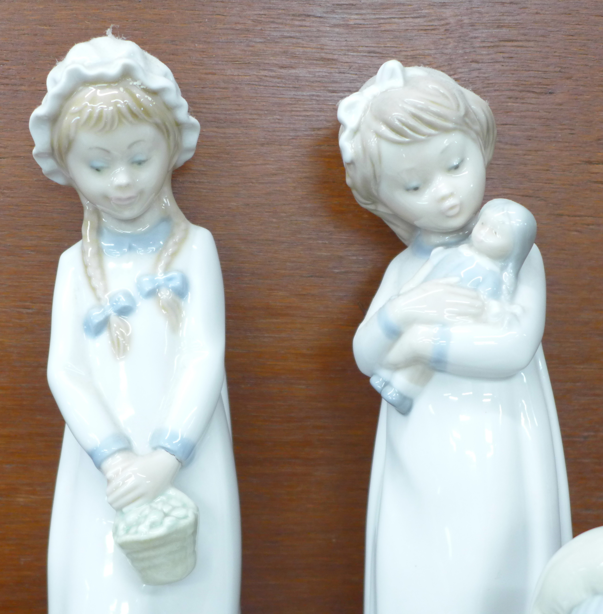 Two Lladro figures, Eskimo with polar bear cub and Girl holding a turkey plus three other Spanish - Image 4 of 7