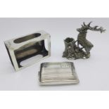 A silver matchbox holder, Birmingham 1913, a silver matchbook holder, Birmingham 1928 and a