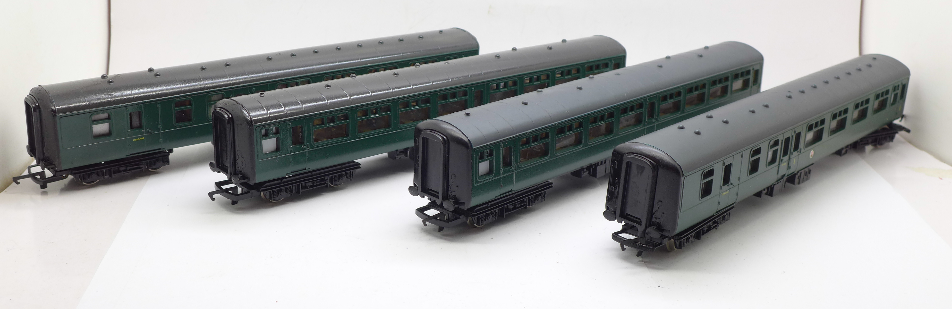 Four OO gauge railway carriages including two Hornby