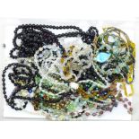 Twenty-nine glass bead necklaces
