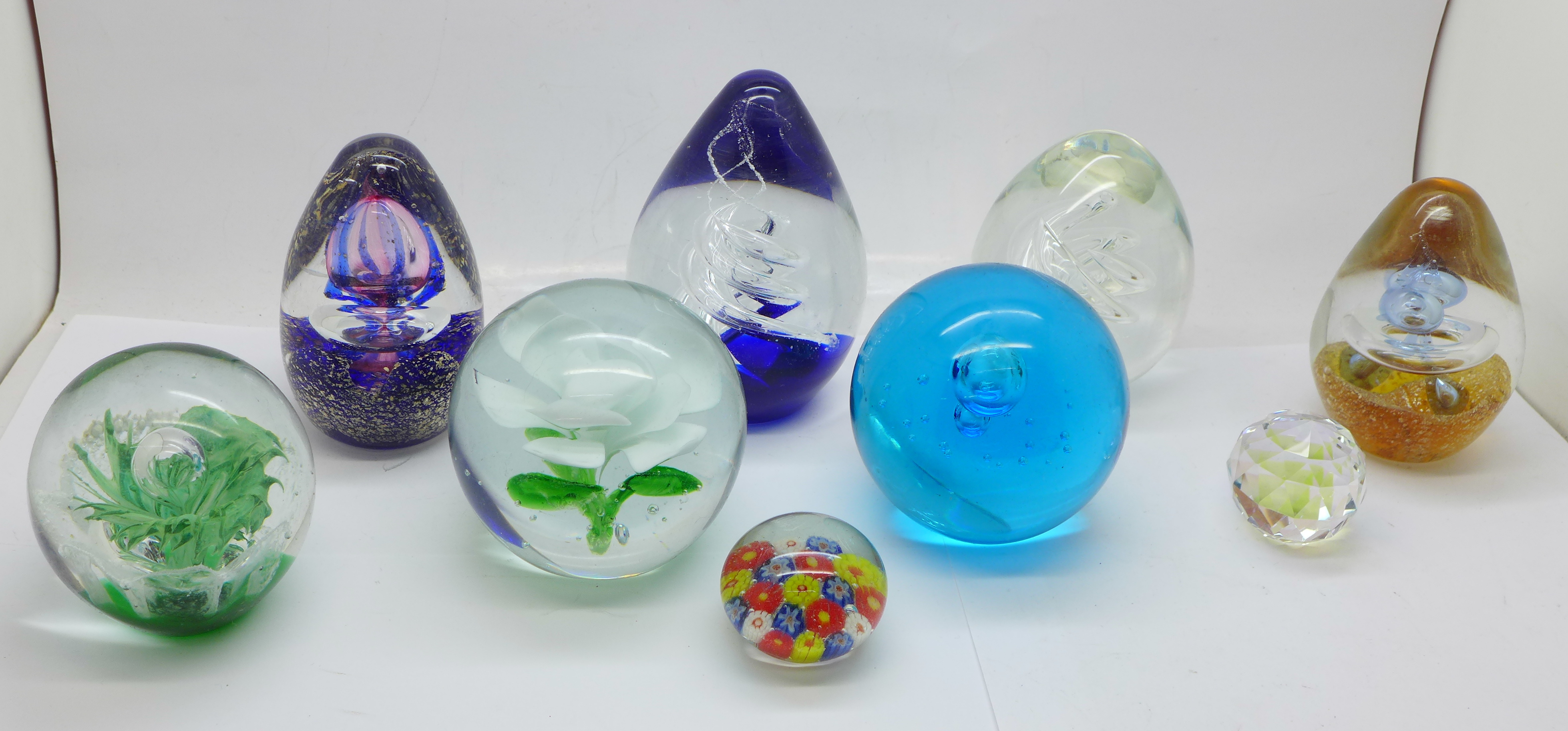 Nine glass paperweights including Millefiori