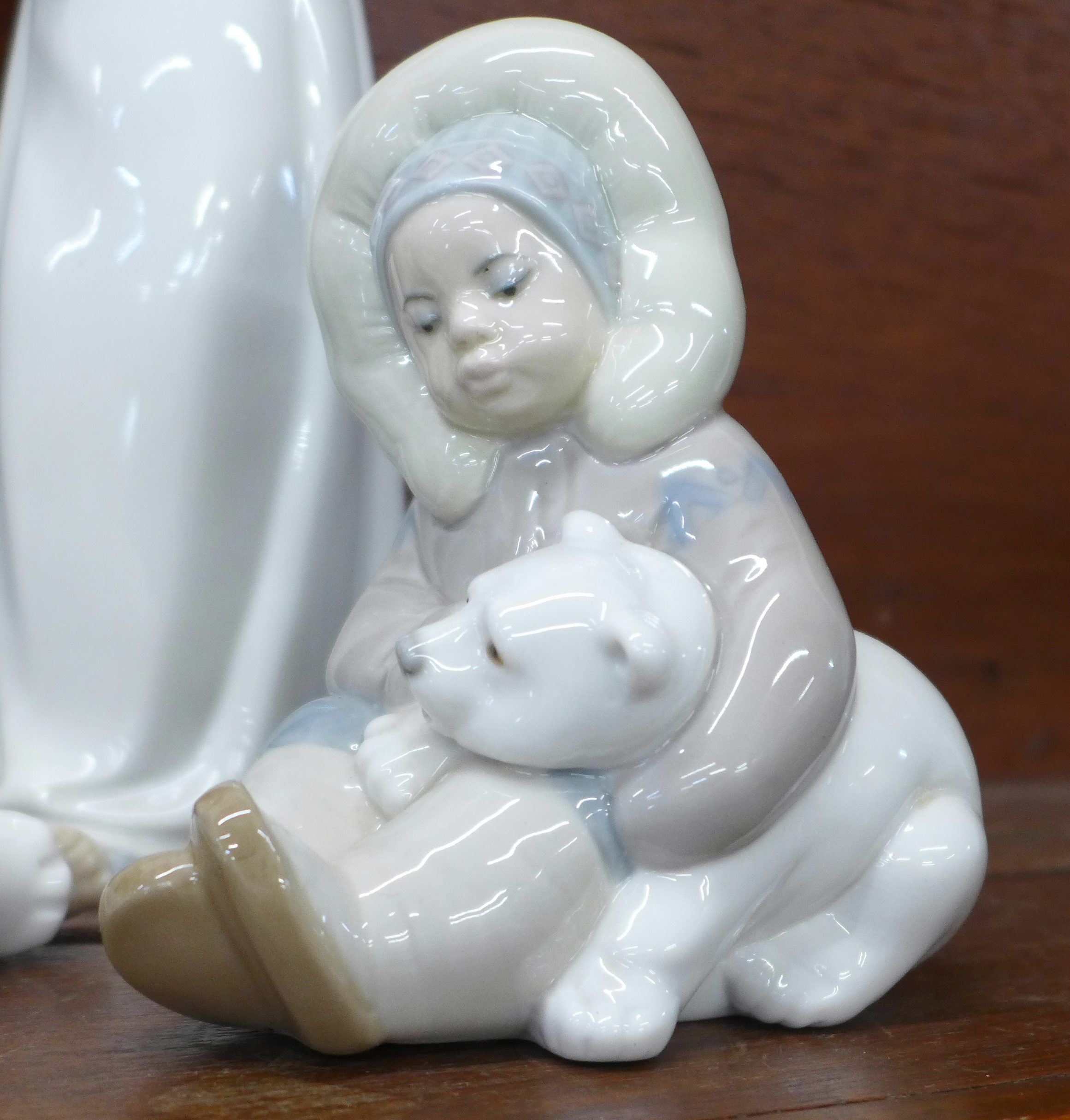 Two Lladro figures, Eskimo with polar bear cub and Girl holding a turkey plus three other Spanish - Image 3 of 7