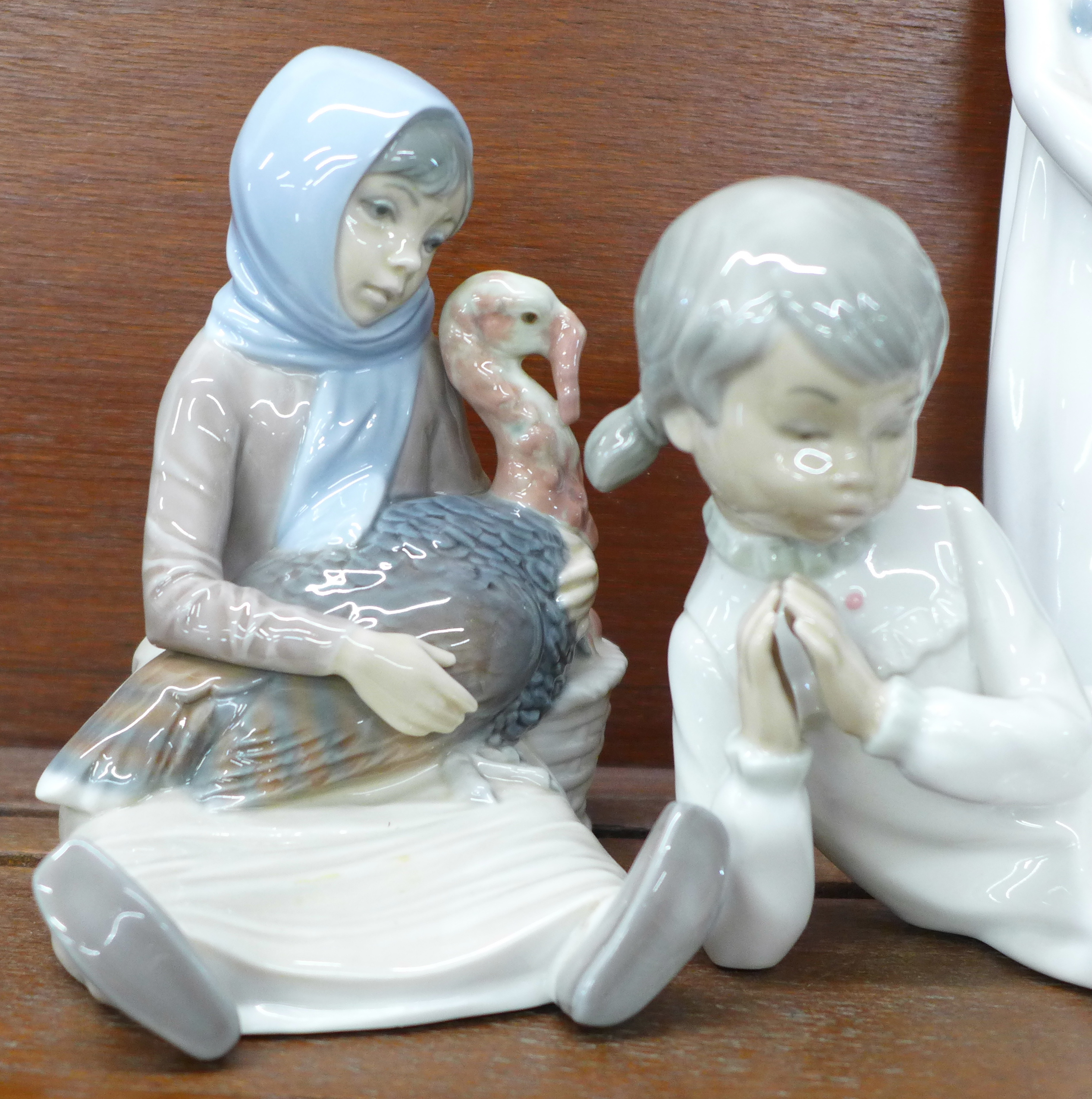 Two Lladro figures, Eskimo with polar bear cub and Girl holding a turkey plus three other Spanish - Image 2 of 7